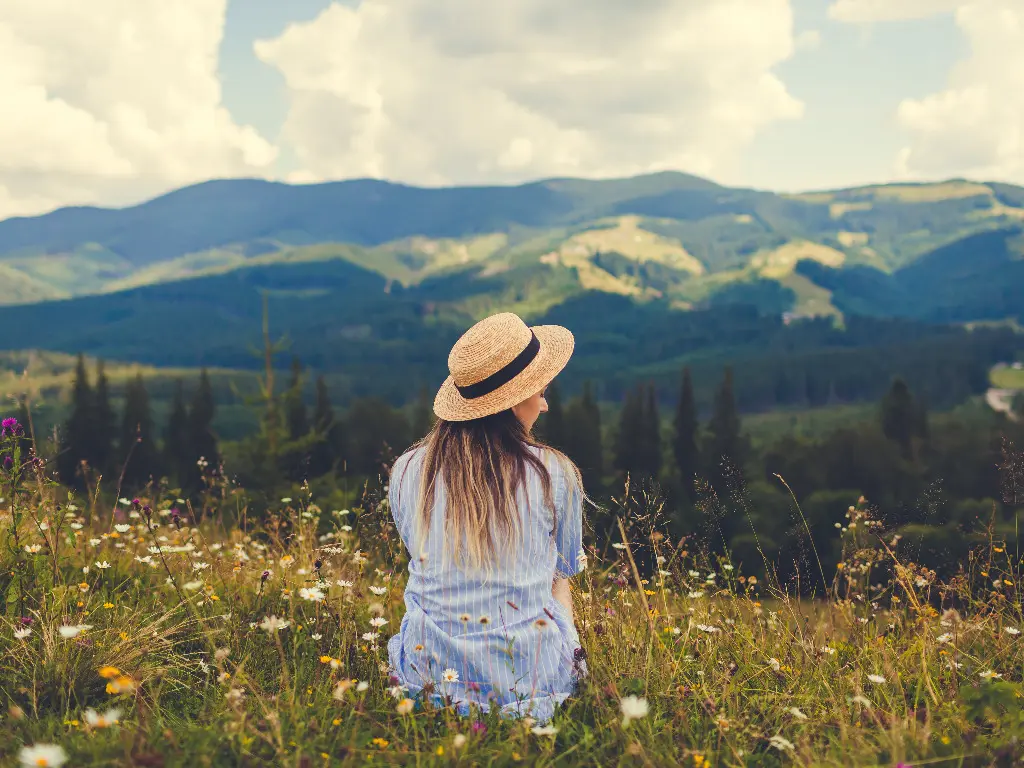 Woman in nature wondering what is EMDR and how does it help me heal?